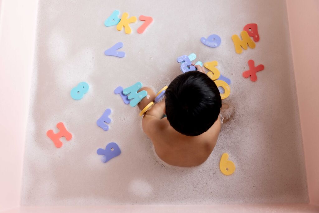 Bath toys and sticky letters provide a fun indoor activity