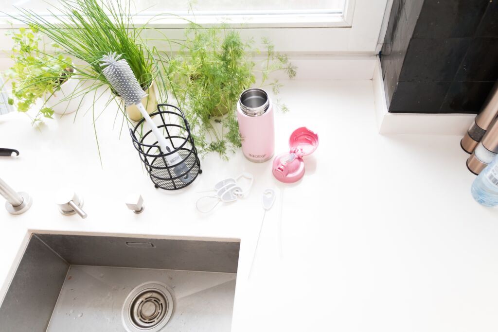 Cleaning bottles with a bottle brush