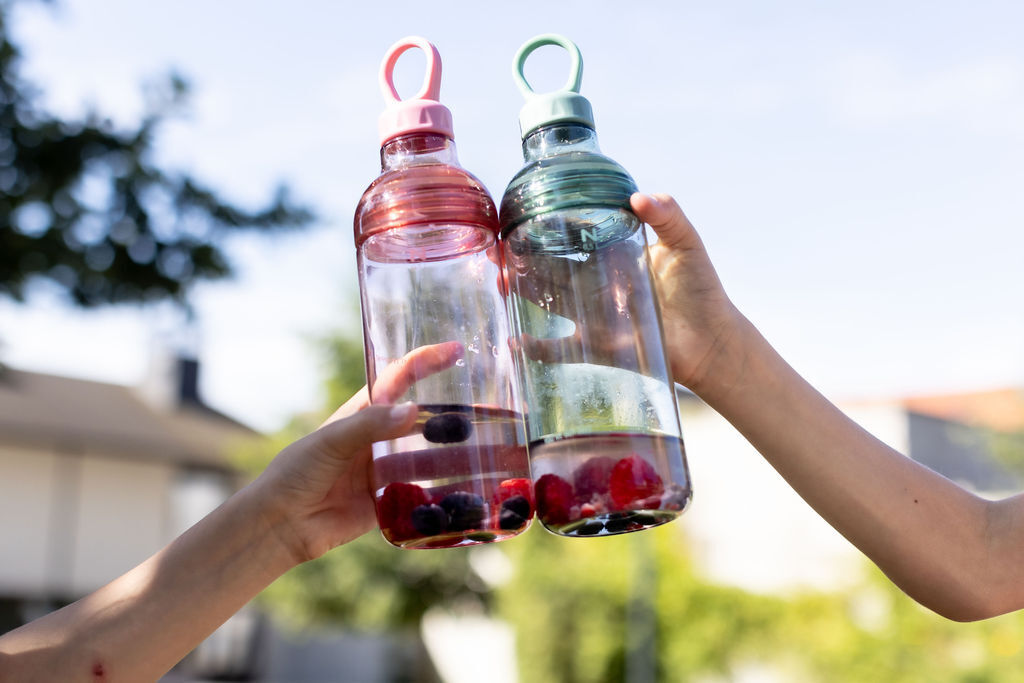 Try adding a bit of fruit to their water bottle to make hydrating more fun