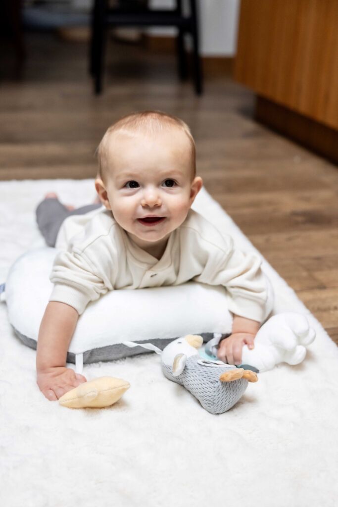 Tummy time becomes a party with a tummy time trainer